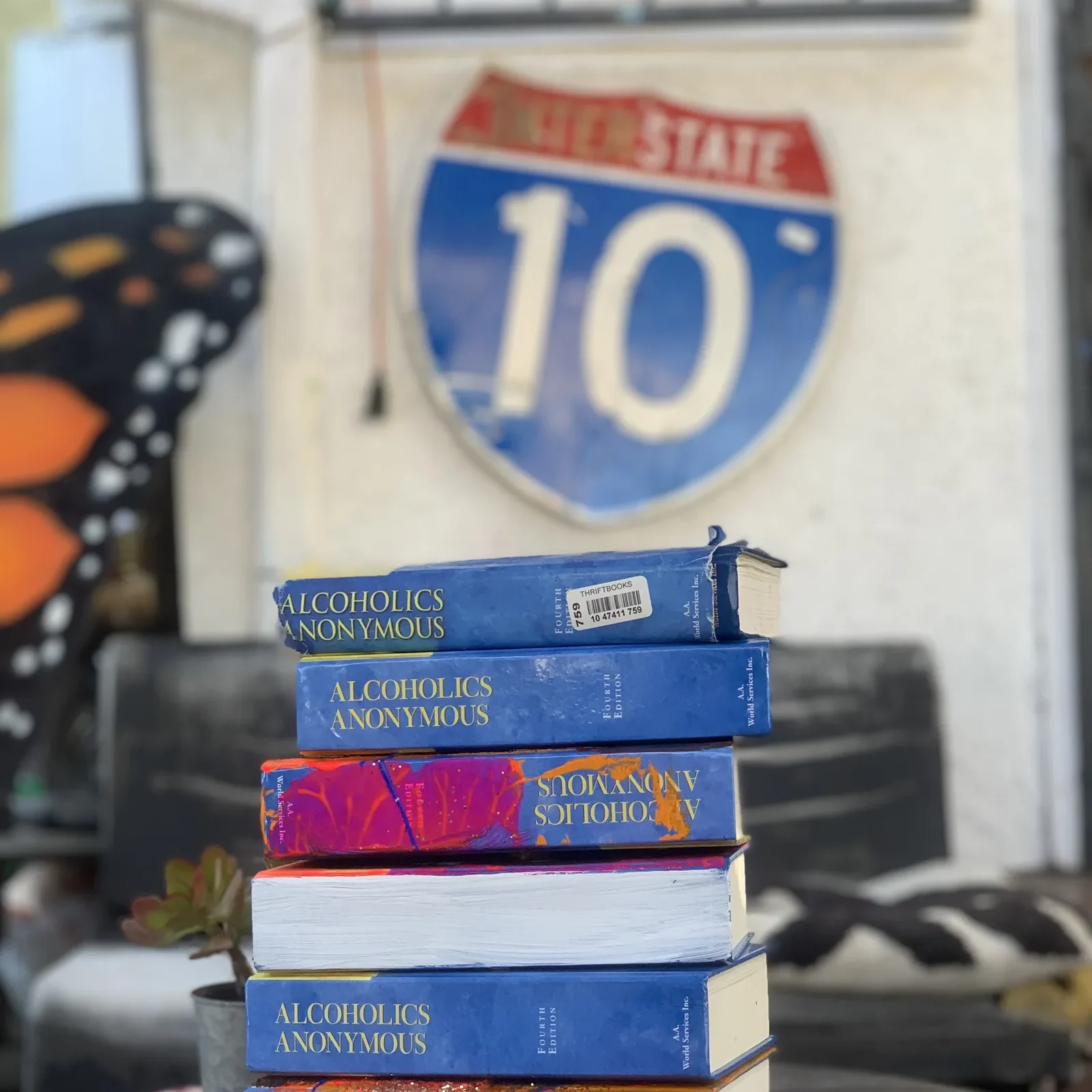 A photograph of recovery-based literature painted in bright colors.