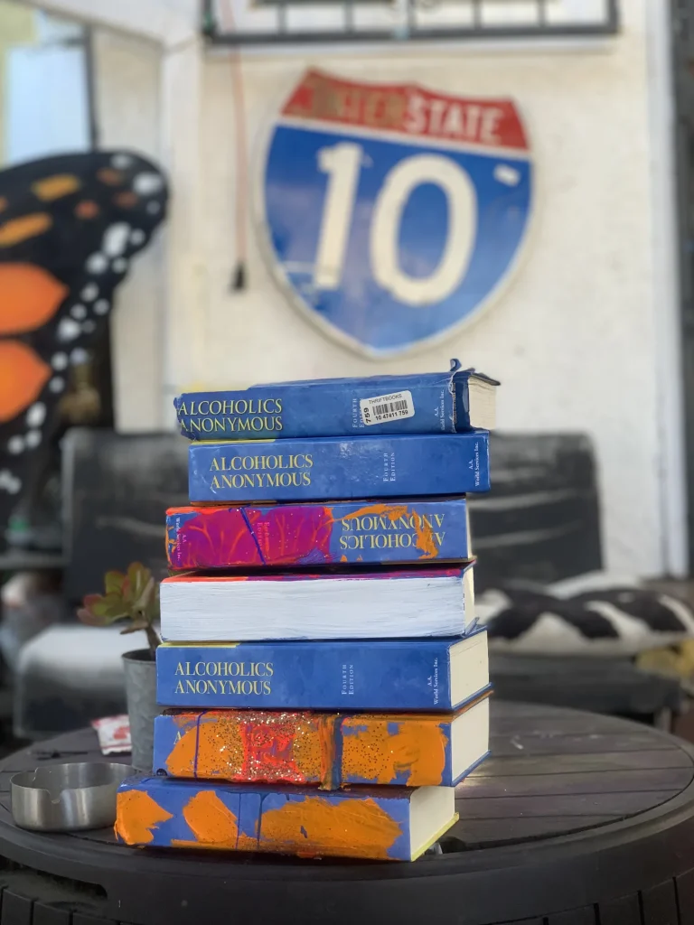 A photograph of recovery-based literature painted in bright colors.